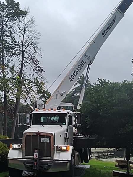 Large crane staged at a waterfront property in York